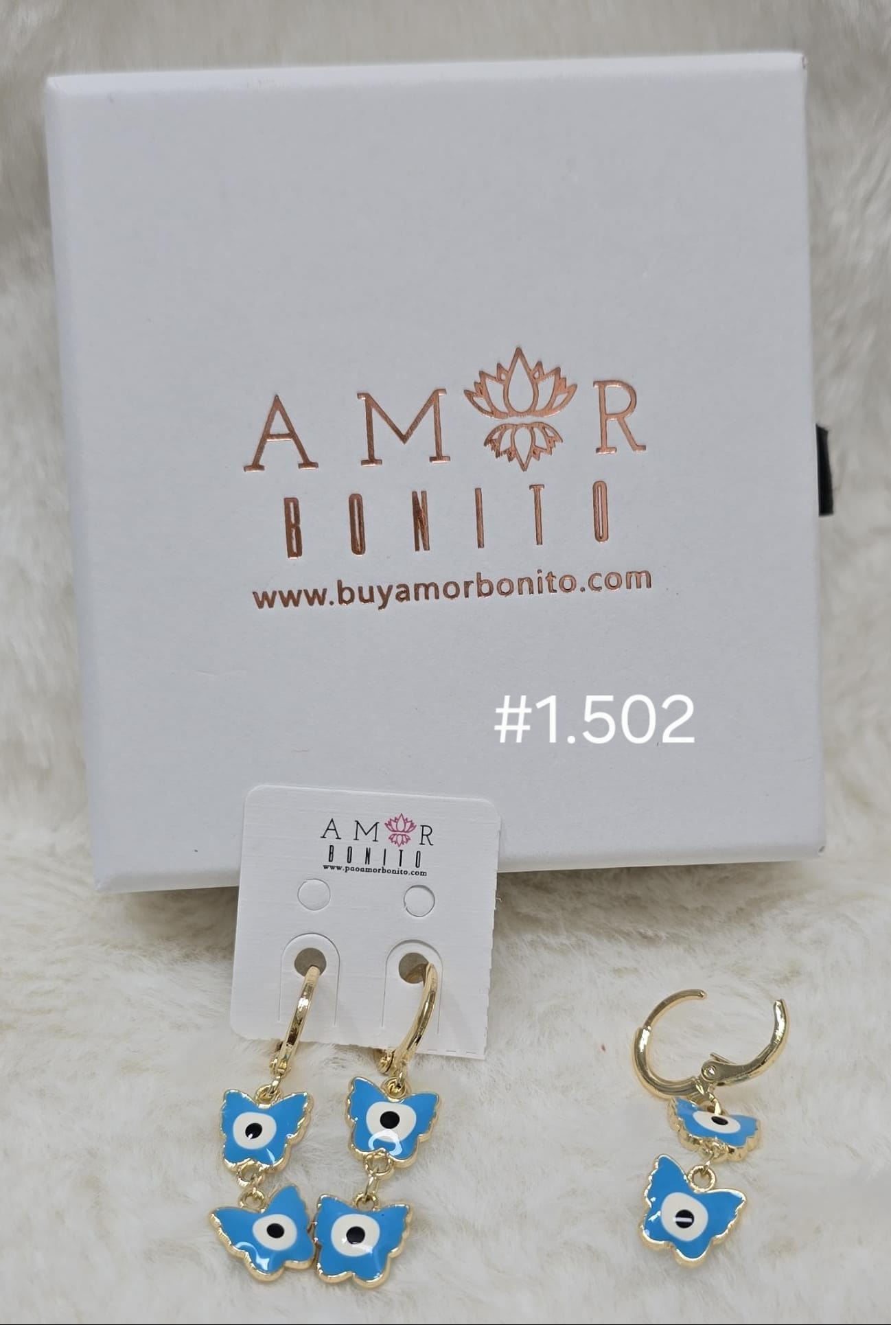 ARETE COLGANTE 2 OJOS AZUL CIELO #1.502